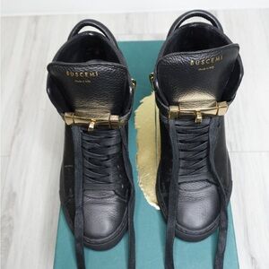 Buscemi Black and Gold High-Top Sneakers
MM-Alta
